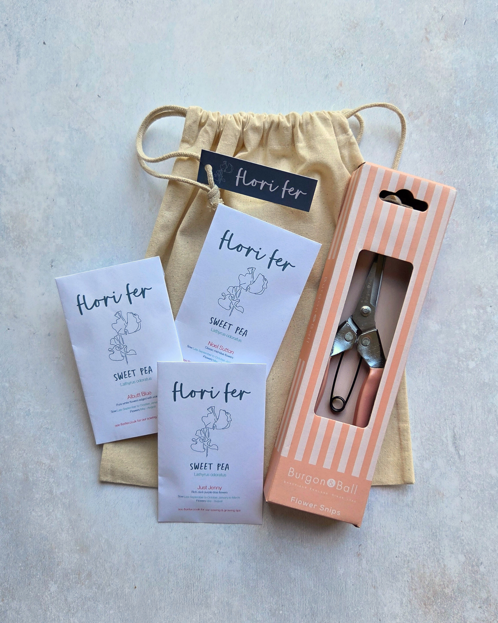 Flori Fer sweet pea seeds and a set of Burgon & Ball Flower Snips in striped gift packaging with a cotton gift bag