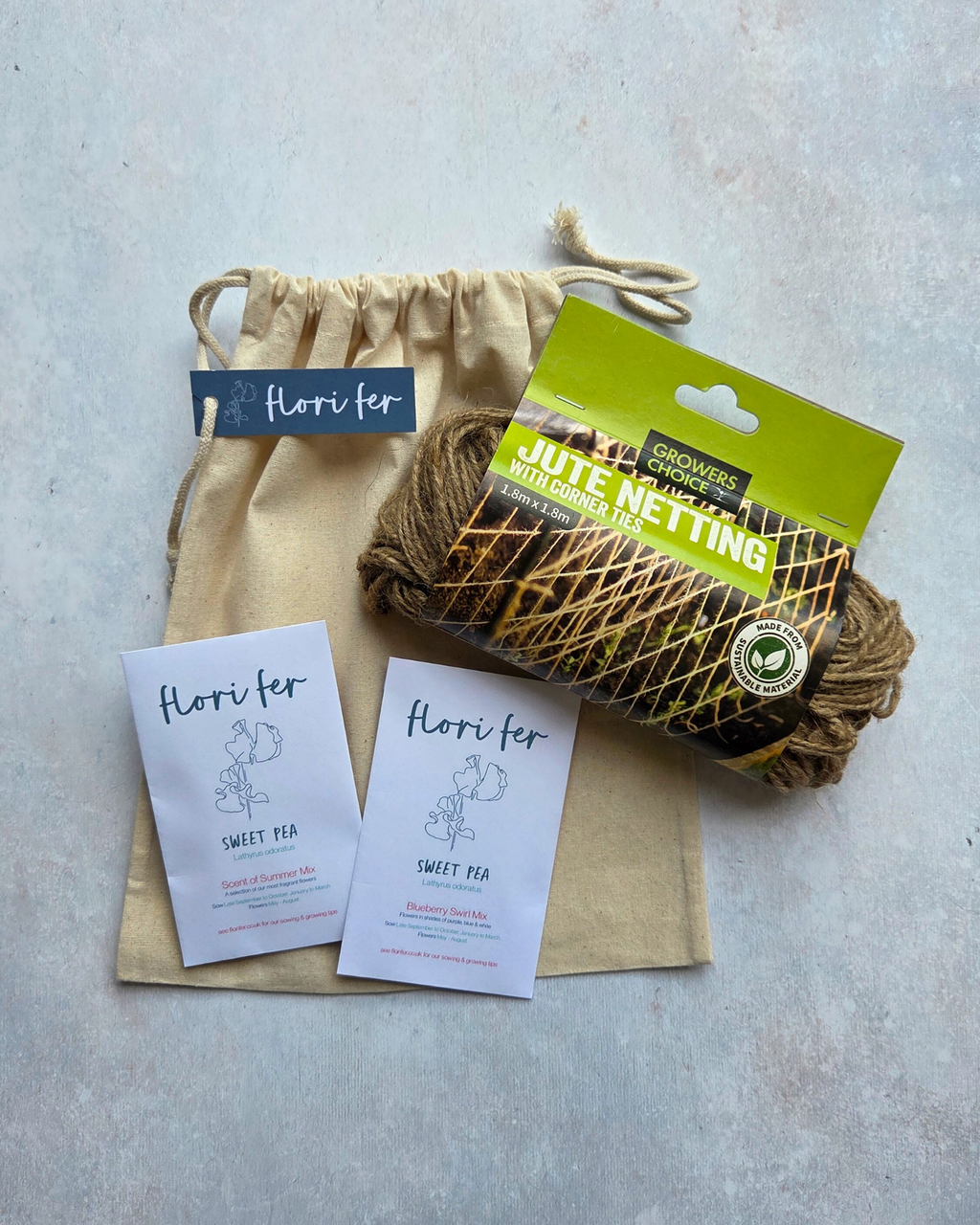 A Sweet Pea starter kit including two packs of Sweet Pea seeds with jute netting and a cotton gift bag